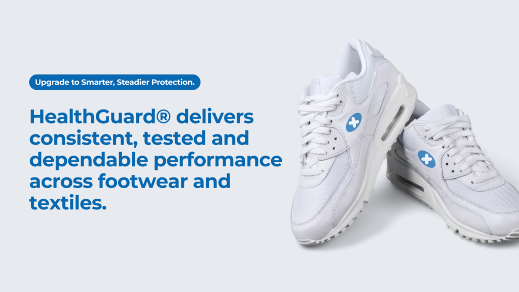 White sneakers displayed with HealthGuard logo, representing consistent anti-microbial protection across footwear and textiles.